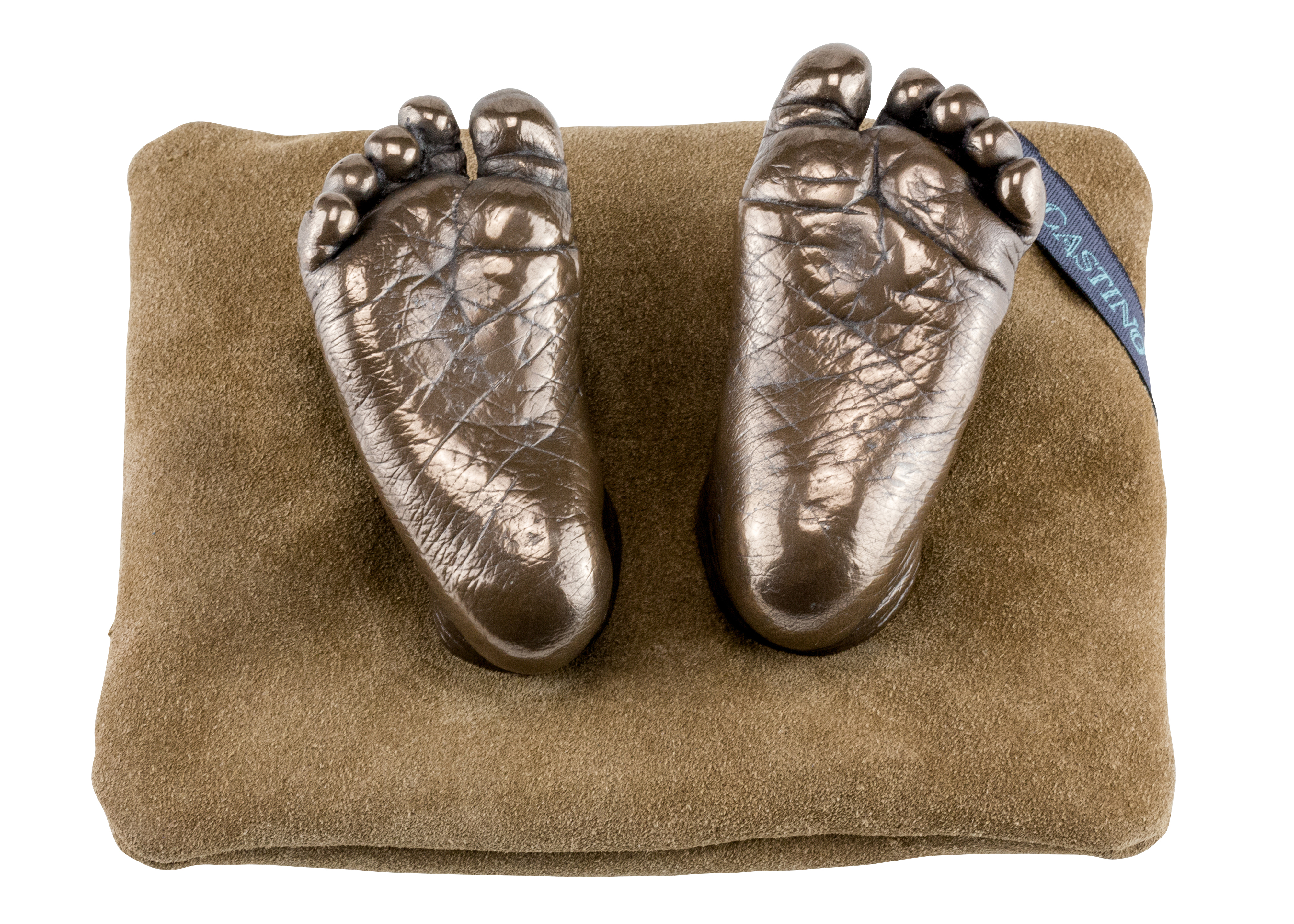 bronze cold casts feet on cushion 